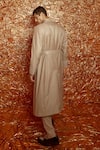 Shop_Nirmooha_Beige Suiting Notch Collar Trench Coat With Belt _at_Aza_Fashions