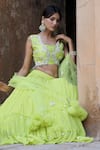 Shop_Nitisha Kashyap Official_Green Georgette, Net, Silk Beads, Mirrors, Zari Embroidered Tiered Lehenga Set _Online_at_Aza_Fashions