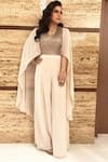 Shop_Rohit Gandhi + Rahul Khanna_Cream Viscose Embellished Bugle And Crystals V Neck Mystic Cape Sleeve Jumpsuit _at_Aza_Fashions