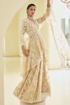 Buy_Seema Gujral_Beige Net Embroidered Sequin Paisley High-low Jacket Sharara Set _at_Aza_Fashions