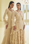 Seema Gujral_Beige Net Embroidered Sequin Paisley High-low Jacket Sharara Set _at_Aza_Fashions