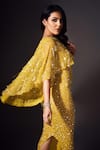 Buy_Chisel by Meghna Ramrakhiya_Yellow Stretchable Net Hand Embellished Sequins Bodycon Cape Gown  _Online_at_Aza_Fashions