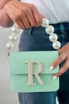 Buy_Prerto_Green Stone Studded Alphabeto Solid Crossbody Bag _at_Aza_Fashions