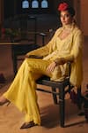 Megha Bansal_Yellow Silk Organza Hand Embroidery Junaira Petal Jacket Pant Set  _at_Aza_Fashions