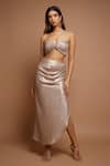Buy_Ahi Clothing_Gold Shimmer Lycra Plain Asymmetric Neck Metallic Draped Top And Skirt Set_at_Aza_Fashions
