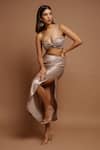 Ahi Clothing_Gold Shimmer Lycra Plain Asymmetric Neck Metallic Draped Top And Skirt Set_at_Aza_Fashions