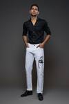 Buy Rohit Bal Off White Denim Embroidery Monkey Placement Jeans at Aza Fashions Buy_Rohit Bal_Off White Denim Embroidery Monkey Placement Jeans _at_Aza_Fashions
