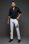 Buy Rohit Bal Off White Denim Embroidery Eagle Placement Jeans at Aza Fashions Buy_Rohit Bal_Off White Denim Embroidery Eagle Placement Jeans _at_Aza_Fashions