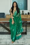 Shop_DILNAZ_Emerald Green Net Embellished Sequin Applique Saree  _at_Aza_Fashions