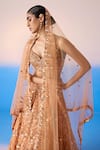 Mirroir_Peach Organza Silk Embellished Sequin Sweetheart Floral Jaal Bridal Lehenga Set _at_Aza_Fashions