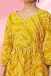 Naintara Bajaj_Yellow Cotton Bandhani Print Peplum Top_at_Aza_Fashions