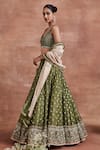 Sue Mue_Green Tissue Silk Woven Dharini Pearl Embroidered Bridal Lehenga Set For Women_at_Aza_Fashions