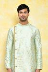 Shop_Arihant Rai Sinha_Green Kurta Jacquard Asymmetric And Churidar Set _Online_at_Aza_Fashions