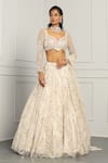 MeenaGurnam_Ivory Net Embroidery Beads Asymmetric Neck Floral Sequin Bridal Lehenga Set _Online_at_Aza_Fashions