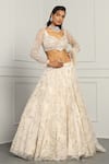 Buy_MeenaGurnam_Ivory Net Embroidery Beads Asymmetric Neck Floral Sequin Bridal Lehenga Set _Online_at_Aza_Fashions