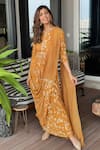 Buy_ABSTRACT BY MEGHA JAIN MADAAN_Yellow Foil Print Georgette Buttercup Bloom Embellished Draped Saree Gown _at_Aza_Fashions