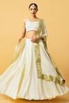 Buy_Quench A Thirst_Ivory Modal Satin Lace V-neck Plain Lehenga Set With Border Dupatta _at_Aza_Fashions