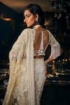 Shop_Seema Gujral_Ivory Net Embroidered Sequins Plunged V Floral Saree With Blouse_at_Aza_Fashions