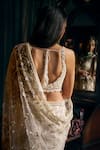 Shop_Seema Gujral_Ivory Net Embroidered Pearls Plunged V 3d Floral Saree With Blouse _at_Aza_Fashions