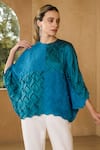 Buy_Pleats by Aruni_Blue Crepe Textured Round Neck Sydney Blouse _at_Aza_Fashions