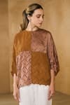 Shop_Pleats by Aruni_Brown Crepe Textured Round Neck Sydney Dual Tone Blouse _Online_at_Aza_Fashions