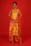 Buy_SAKSHAM & NEHARICKA_Orange Velvet Hand Painted Floral Round Ebru Kurta And Pant Set  _at_Aza_Fashions