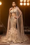 Buy_Kavita arora_Cream Net Hand Embroidered Crystals Cape Round Lehenga Set  _at_Aza_Fashions