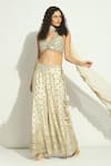 Vandana Sethi_Ivory Silk Crystals, Zari Halter Neck Mirror Embroidered Blouse Sharara Set _at_Aza_Fashions