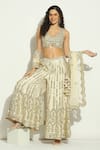 Vandana Sethi_Ivory Dupion Silk Embroidery Mirror V Neck Blouse Sharara Set _at_Aza_Fashions