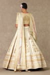 Shop_Masaba_Ivory Lehenga And Blouse Raw Silk Embellished Dori V Neck Neel Kamal Bridal Set_at_Aza_Fashions