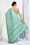 Shop_Nazaakat by Samara Singh_Green Banarasi Silk Woven Floral Patterned Saree With Running Blouse Fabric_at_Aza_Fashions