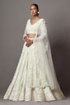 Mala and Kinnary_Ivory Net Embroidered Pearl V-neck Scallop Bridal Lehenga Set _Online_at_Aza_Fashions