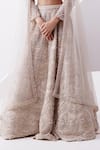 Istya_Beige Net Embroidery Cutdana Plunging V Neck Scallop Sequin Bridal Lehenga Set _Online_at_Aza_Fashions