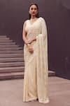 Buy_Istya_Beige Foil Chinon Embroidery Sequins V Neck Geometric Saree With Blouse _at_Aza_Fashions