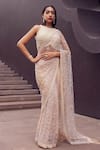 Shop_Istya_Beige Net Embroidery Pearls Round Neck And Sequin Saree With Blouse _at_Aza_Fashions