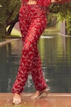 Istya_Red Net Embroidered Sequins Bustier V Neck Tassel Pant Set With Crop Jacket _Online_at_Aza_Fashions