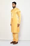 Shop_Arihant Rai Sinha_Yellow Satin Plain Churidar _Online_at_Aza_Fashions