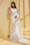 Buy_Istya_Ivory Saree And Blouse- Net Embroidered Sequins V Neck Draped Lehenga With _at_Aza_Fashions