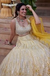 Chamee and Palak_Yellow Dupion Silk Mia And Leather Applique Work Bridal Lehenga Set  _Online_at_Aza_Fashions