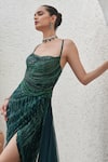 Mahima Mahajan_Green Net Embellished Sequin Halter Neck Tabia Wave Slit Gown _at_Aza_Fashions