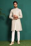 Shop_KUSTOMEYES_Ivory Raw Silk Embellished Moti Sherwani Set _at_Aza_Fashions
