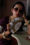 Shop_THE TAN CLAN_Gold Mother Of Pearls Pankh Embellished Clutch _at_Aza_Fashions