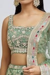 MeenaGurnam_Green Blouse Russian Silk Woven Floral Square Neck Blossom Pattern Lehenga Set _at_Aza_Fashions