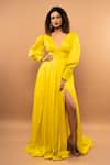 Buy_Ranbir Mukherjee Calcutta_Yellow Satin Georgette Solid Plunge V-neck Pleated Gown  _at_Aza_Fashions