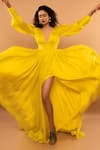 Ranbir Mukherjee Calcutta_Yellow Satin Georgette Solid Plunge V-neck Pleated Gown  _at_Aza_Fashions