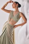 Shop_Mandira Wirk_Green Crinkle Embellished Bead Plunging V Sleeveless Corset Pre-draped Saree Set _at_Aza_Fashions