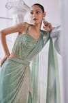 Shop_Mandira Wirk_Green Net Embroidered Sequin Sweetheart Layered Lehenga Saree Set _at_Aza_Fashions