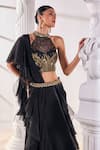 Shop_Mandira Wirk_Black Net Embroidered Cutdana Halter Corset Pre-draped Ruffled Saree Set_at_Aza_Fashions