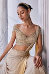 Shop_Mandira Wirk_Cream Net Embroidered Bead Off Shoudler Corset Layered Lehenga Set _at_Aza_Fashions