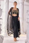 Buy_Mandira Wirk_Black Net Embroidered Sequin Sweetheart And Cutdana Work Draped Skirt Set_at_Aza_Fashions